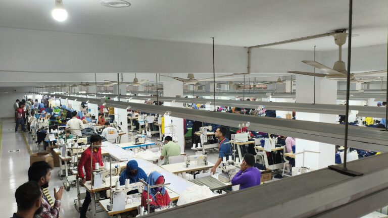 Garment workers operating sewing machines on a factory floor – M&A Sourcing Ltd.