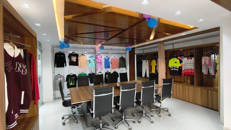 Apparel samples displayed in a showroom meeting area – M&A Sourcing Ltd.
